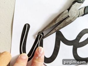 Make Wired Word Signs at Home with Free Template 5 Using needlenose pliers to form sharp wire bends
