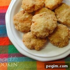 A close up overhead photo of homemade chicken nuggets on a white plate.