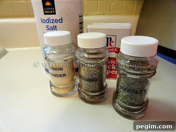 homemade-chicken-nuggets-step-3 A photo of onion powder, oregano and parsley in glass jars.