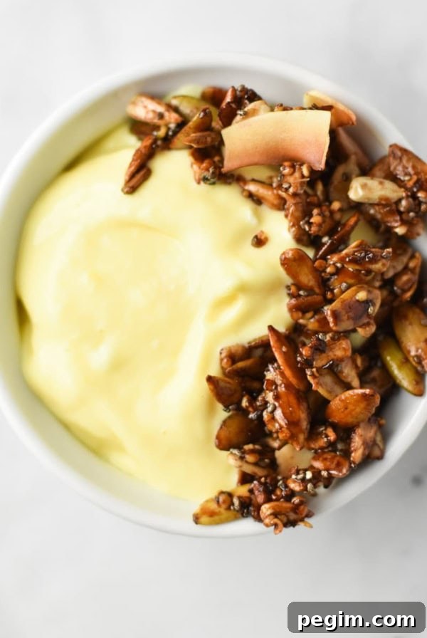 Cottage Cheese with Fruit: Tasty Breakfast and Snack Ideas 13 Mango lassi without yogurt topped with granola.