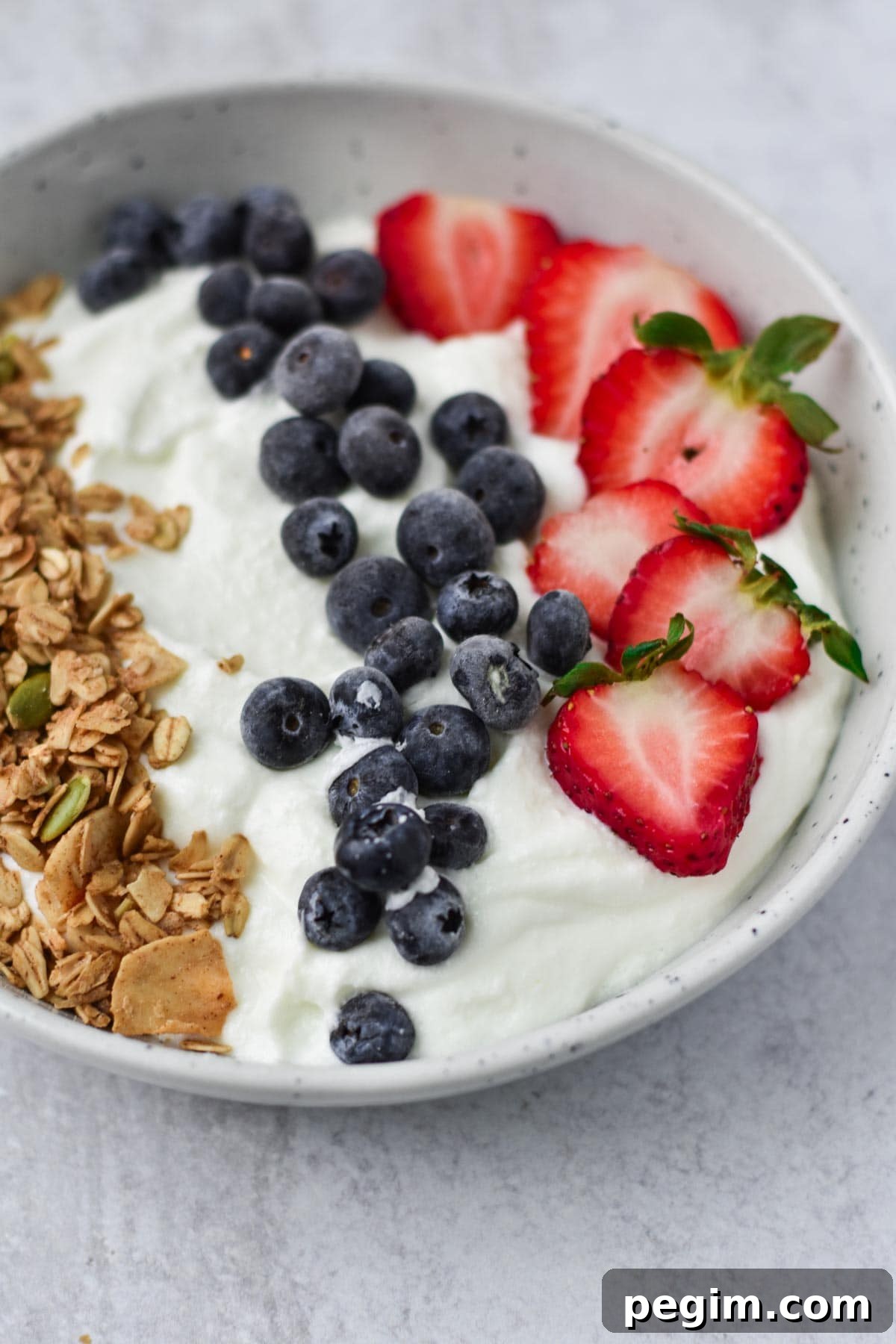 Cottage Cheese with Fruit: Tasty Breakfast and Snack Ideas 7 A white bowl with whipped cottage cheese and berries.