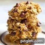 Healthy Pumpkin Chocolate Chip Cookies Stacked on Plate Square Image