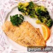 One low carb breaded parmesan cruste flounder fish fillet with broccoli.
