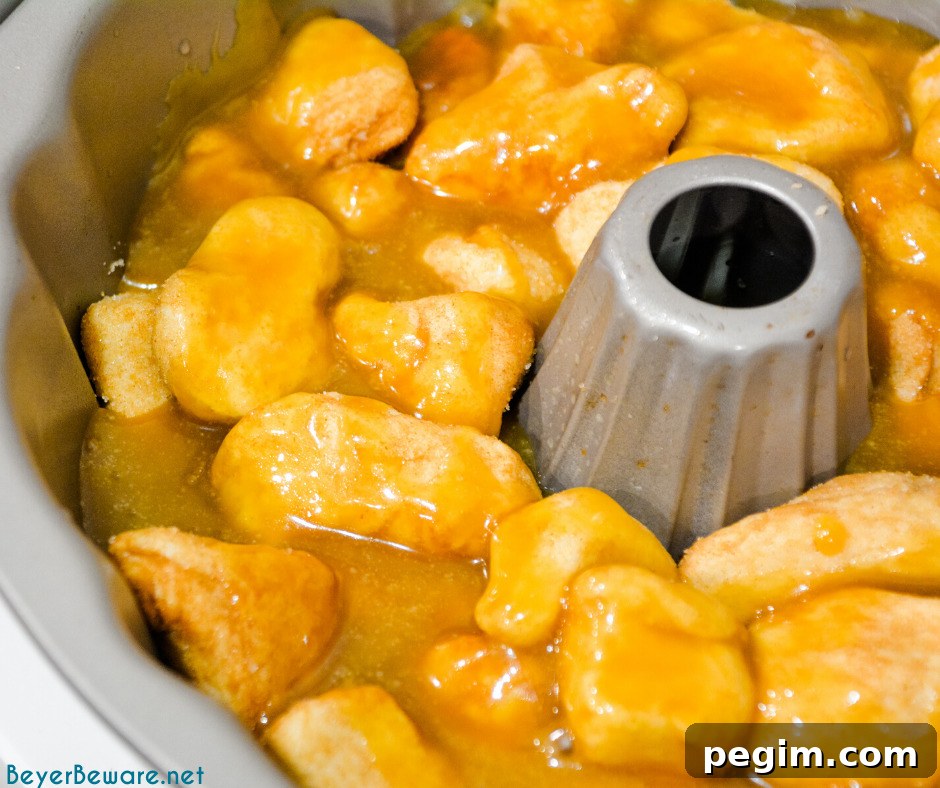 Pull Apart Caramel Monkey Bread Recipe 8 Monkey bread is a caramel pull-apart bread made with Grands biscuits, butter, sugar, and cinnamon then baked in a bundt cake pan for a gooey breakfast bread.