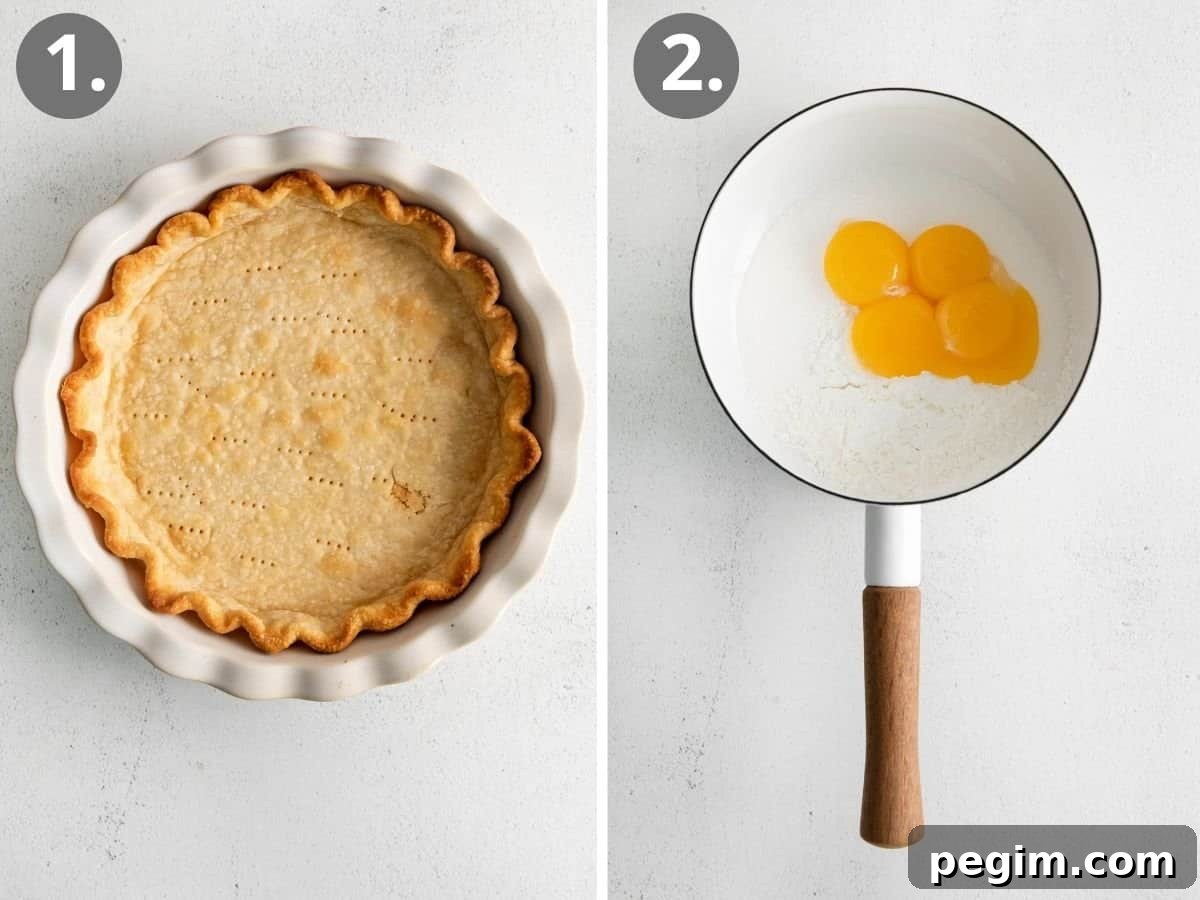 Vegan Coconut Cream Pie Recipe 4 Egg yolks and sugar in a pot, and a coconut cream pie crust in a dish