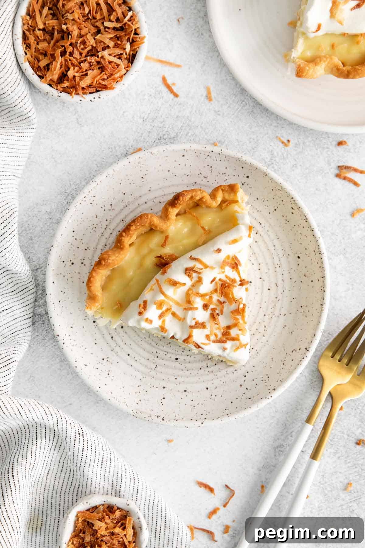 Vegan Coconut Cream Pie Recipe 6 An overhead look at a slice of coconut cream pie on a plate