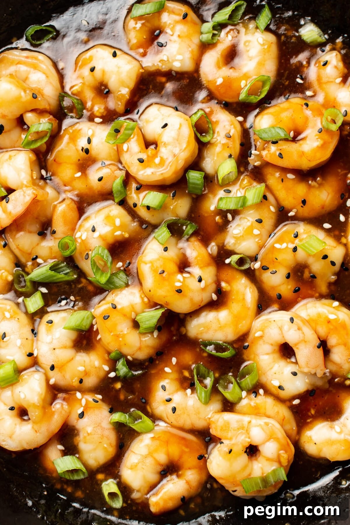 closeup of a skillet with honey garlic shrimp
