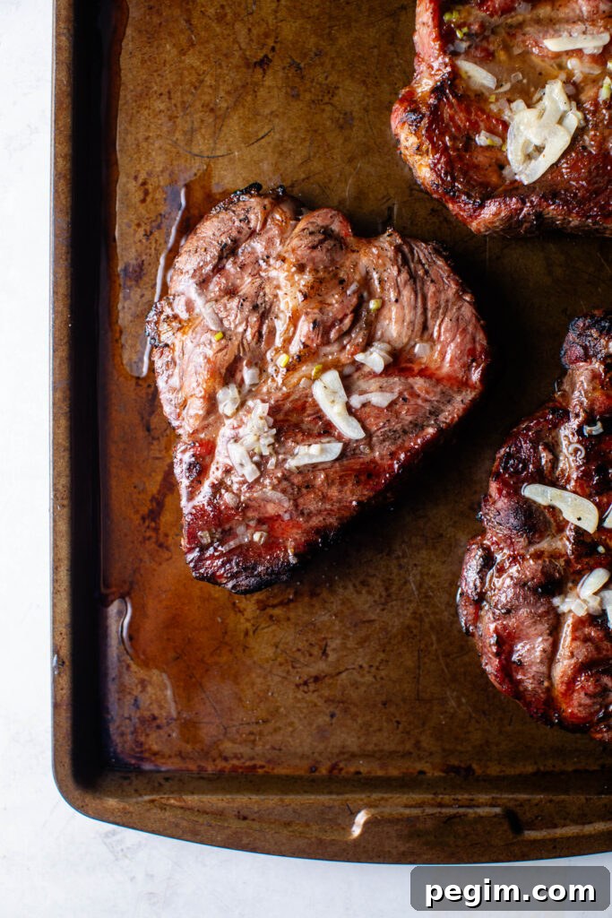 grilled pork coppa steaks with roasted garlic