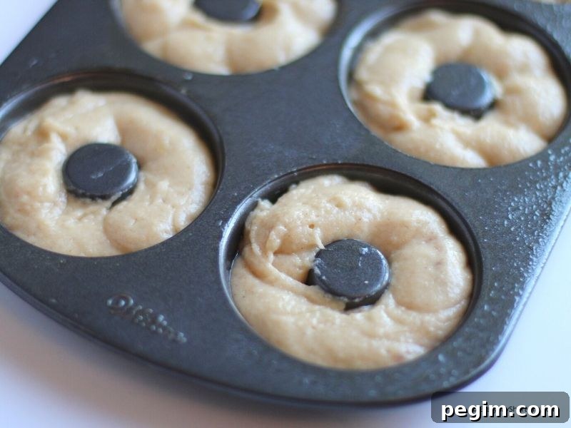 add the donut dough to the donut pan and bake